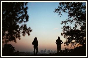 Film photo of two people watching the sunset over Los Angeles