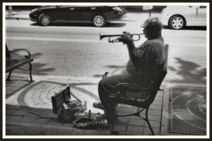 Film photo of someone playing trumpet on the street in Tampa