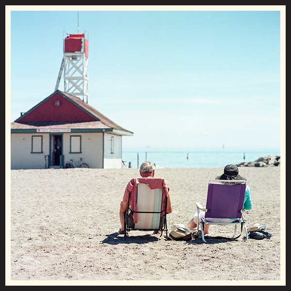 Film photo of people sitting at the beach in Toronto