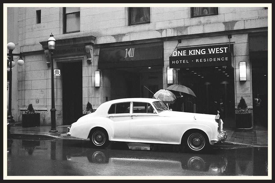Black and white film photo of a vintage car in Toronto