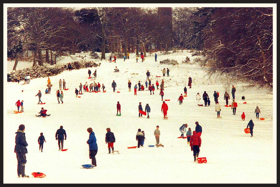 Film photo of children sledding in Scotland in the '70's.