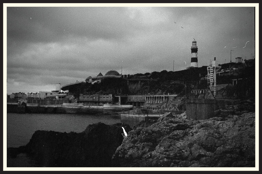 Black and white film photo of a lighthouse in the UK.