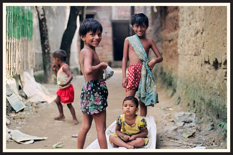 A group of smiling children taken on Kodak Gold 200 film