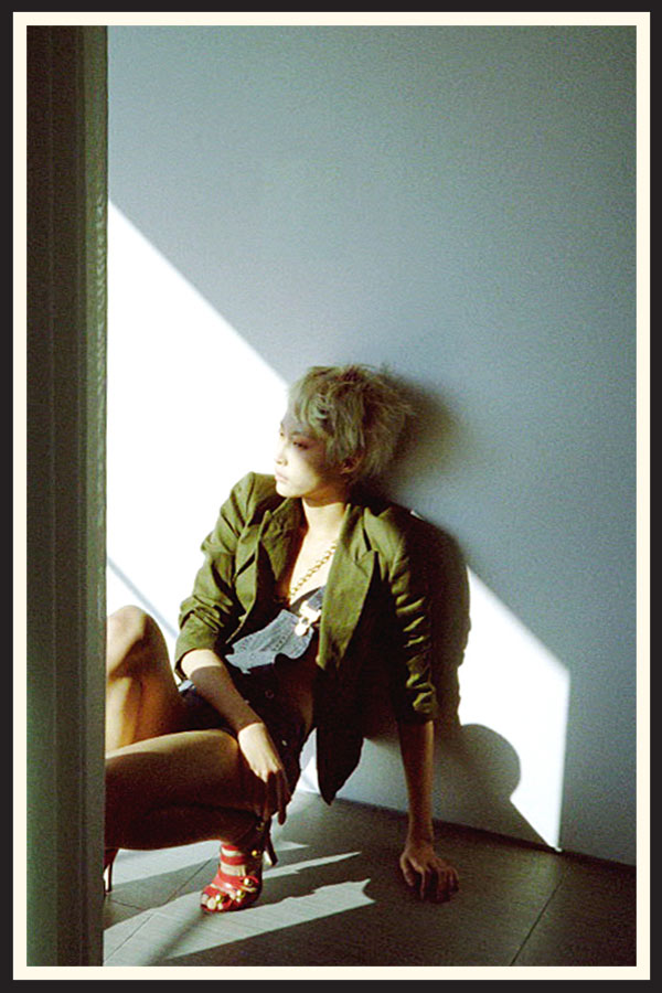 Photo of a model caught in a shadow, taken on Kodak Gold 200 film