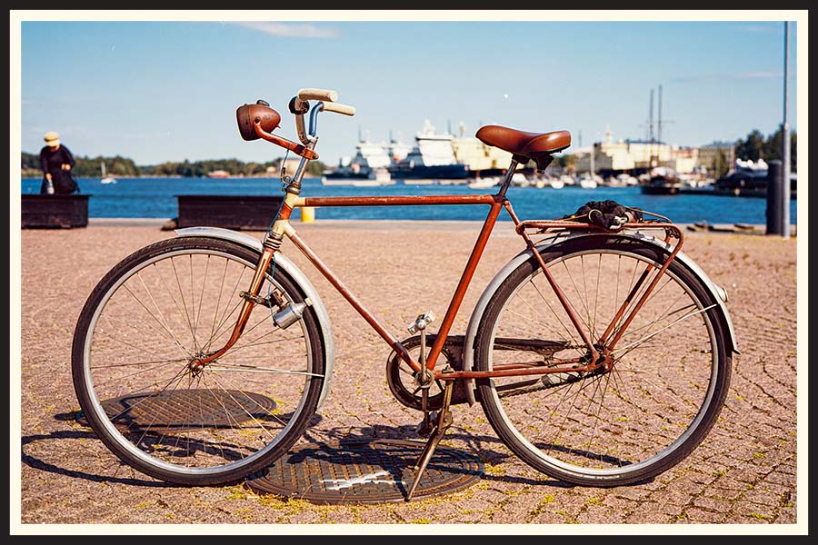 Vintage bicycle by the water taken on Kodak Ektar 100