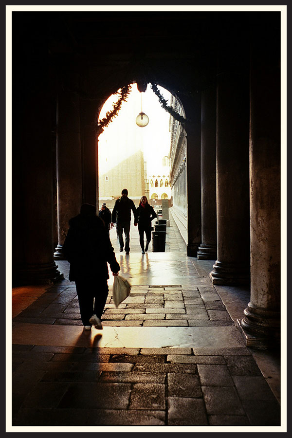 A stone passageway with an arch exposing the bright sunlight, taken on Kodak Ektar 100.