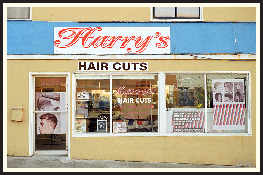 Storefront of a barber shop, taken on Kodak Colorplus 200 film.
