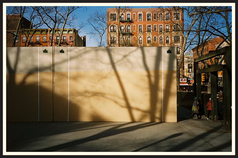 Handball court with large, brick buildings behind it, taken on Portra 800 film.