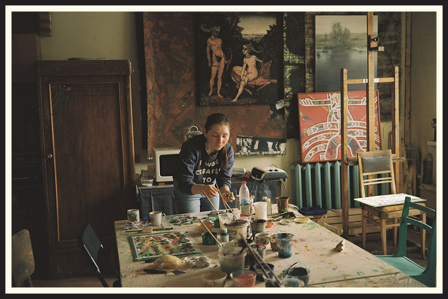 An artist working in their painting studio, taken on Kodak Portra 800 film.