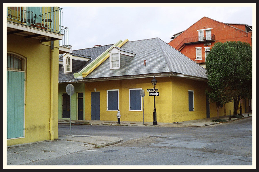 Film photo of a bright yellow building, taken on Portra 800.